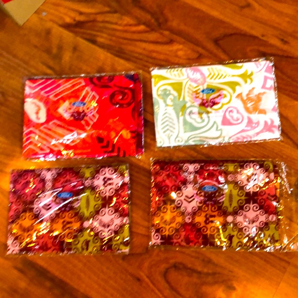 4 scarfs. New never used still in wrappers. The Susan B Komen Race For The Cure